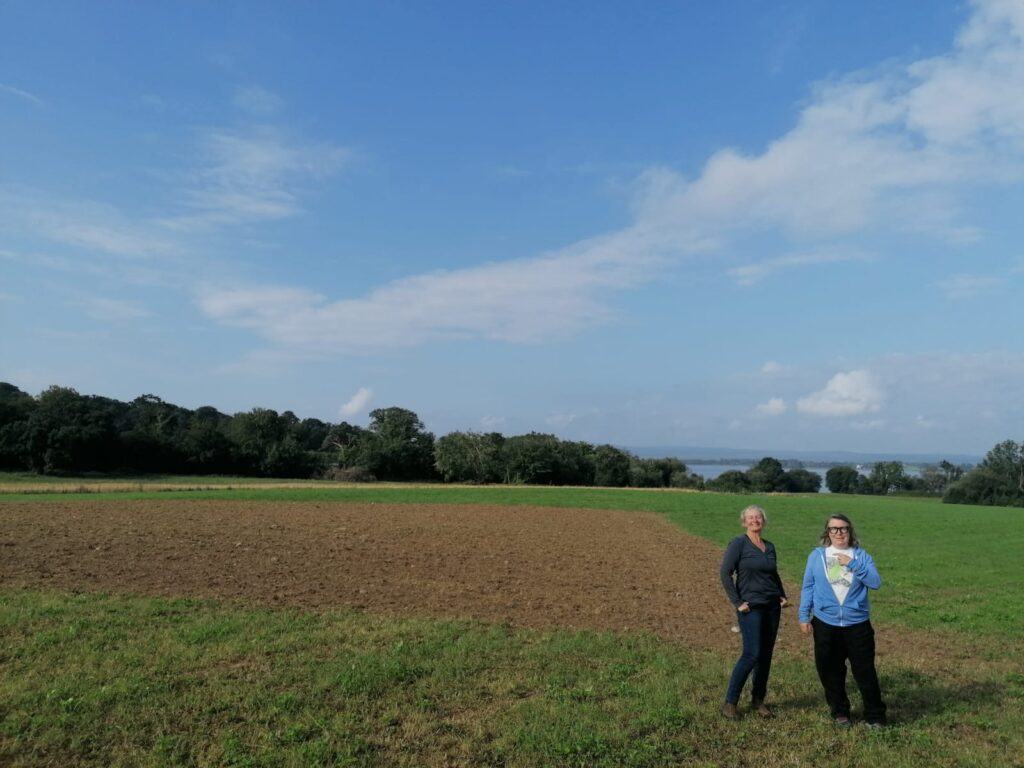 Farmer Ailbhe Gerrard and artist Deirdre O'Mahony on a plot of land at Brookfield Farm