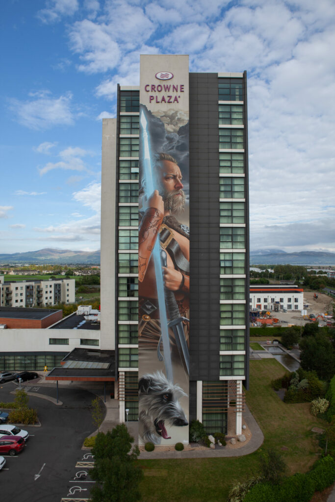 Mural of warrior on tall building